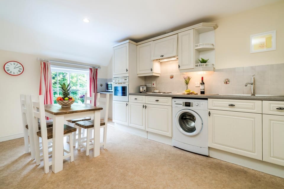 Dining area, microwave, oven, stove, washing machine, kitchen