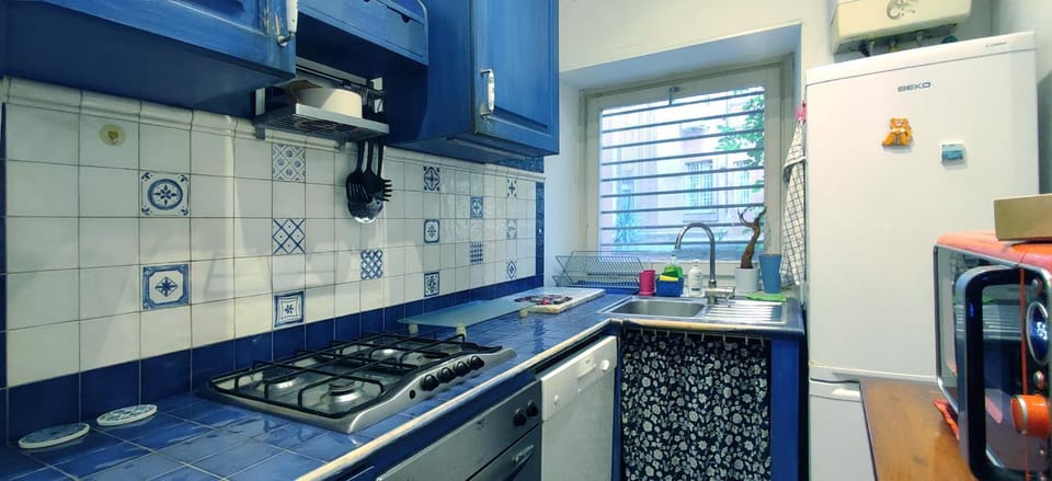 Kitchen or kitchenette, dishwasher, oven, stove