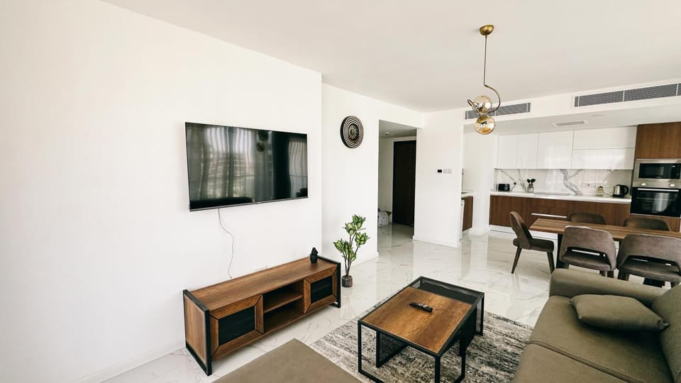 Communal lounge/ TV room, Living room, Seating area, Dining area, stove, air conditioner