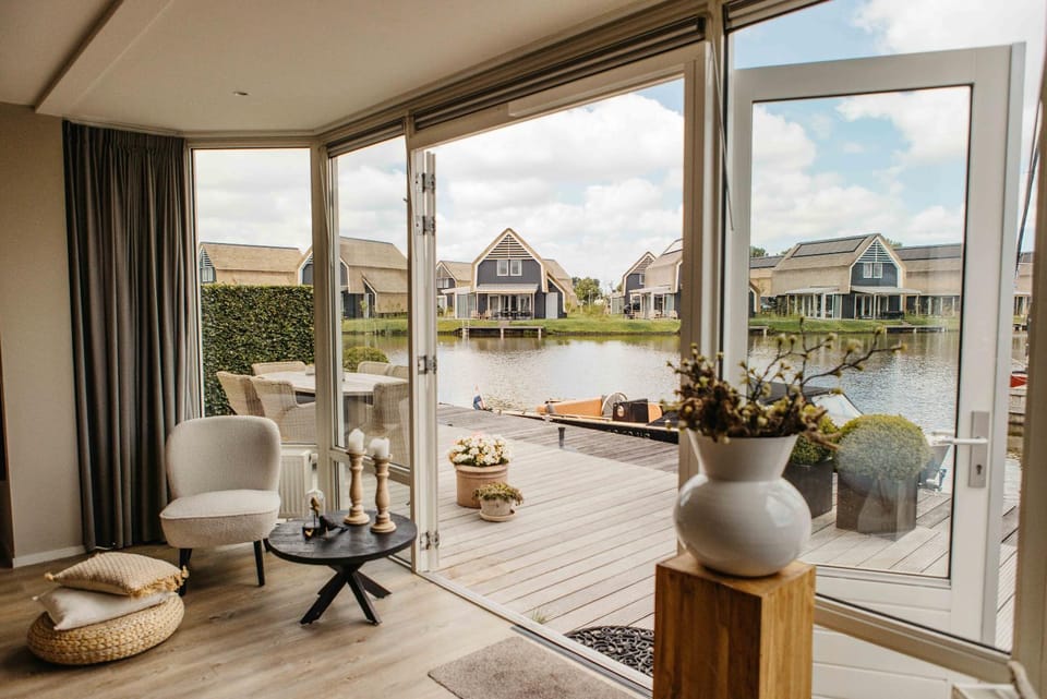 Harbour Villa in Heeg for 6 Guests with Private Dock & Waterfront Terrace House in Friesland, Netherlands