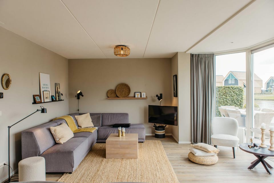 Harbour Villa in Heeg for 6 Guests with Private Dock & Waterfront Terrace House in Friesland, Netherlands