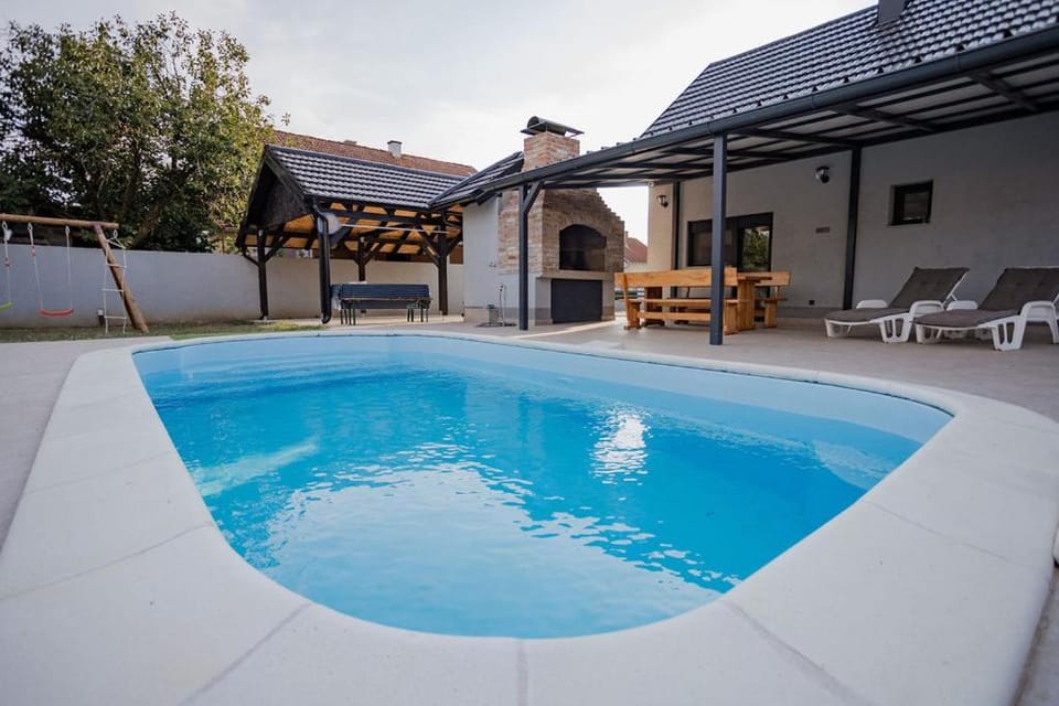 Property building, Patio, Day, Pool view, sunbed