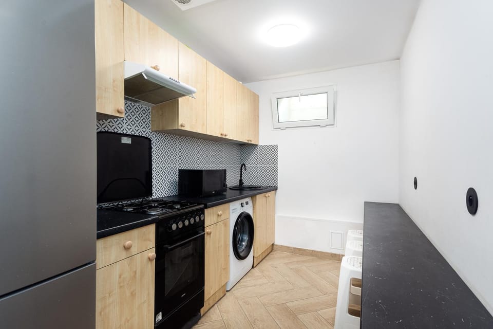 Kitchen or kitchenette, dishwasher, microwave, oven, stove, washing machine, kitchen