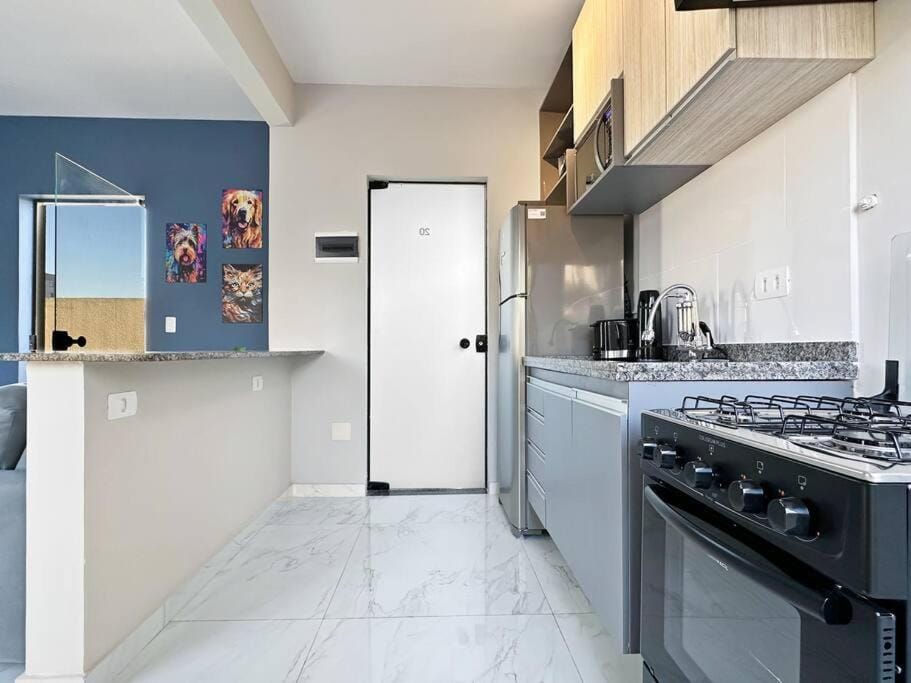 Kitchen or kitchenette, dishwasher, oven, stove