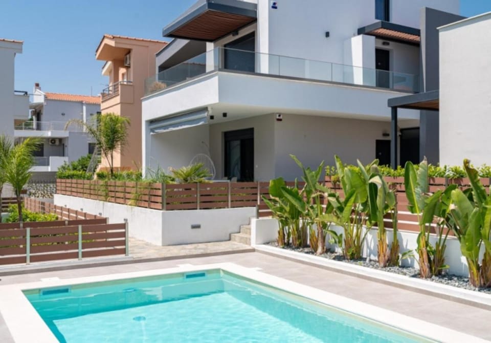 Property building, Patio, Day, Pool view, Swimming pool