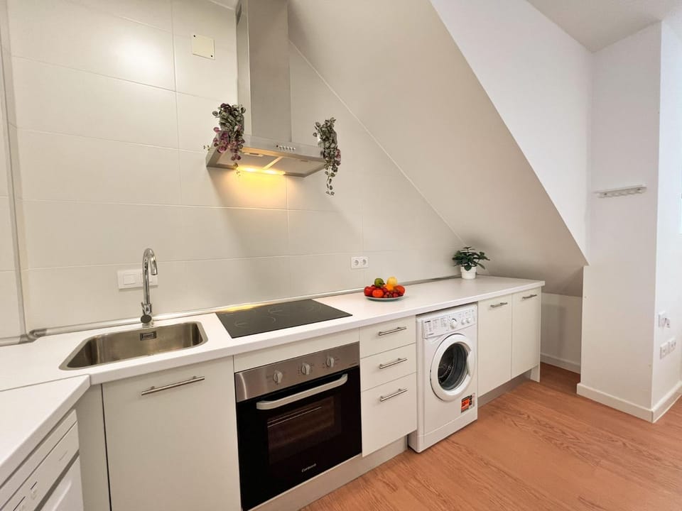 Kitchen or kitchenette, dishwasher, stove, washing machine