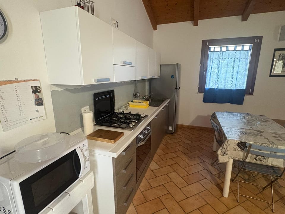 Kitchen or kitchenette, microwave, oven