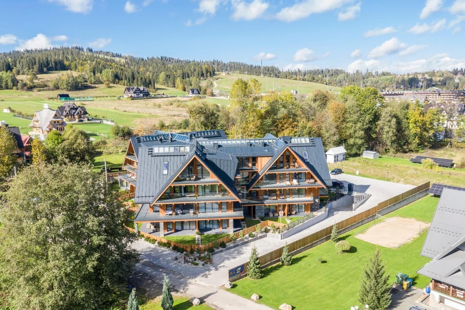 Property building, Spring, Day, Natural landscape, Bird's eye view, Skiing, Mountain view