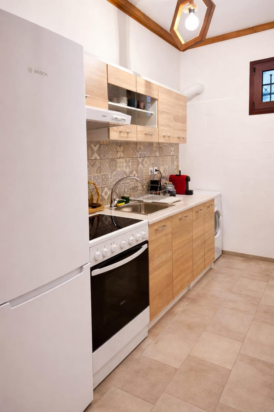 Kitchen or kitchenette, stove, washing machine