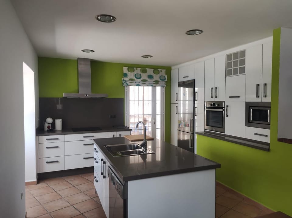 Kitchen or kitchenette, dishwasher, oven, stove, toaster
