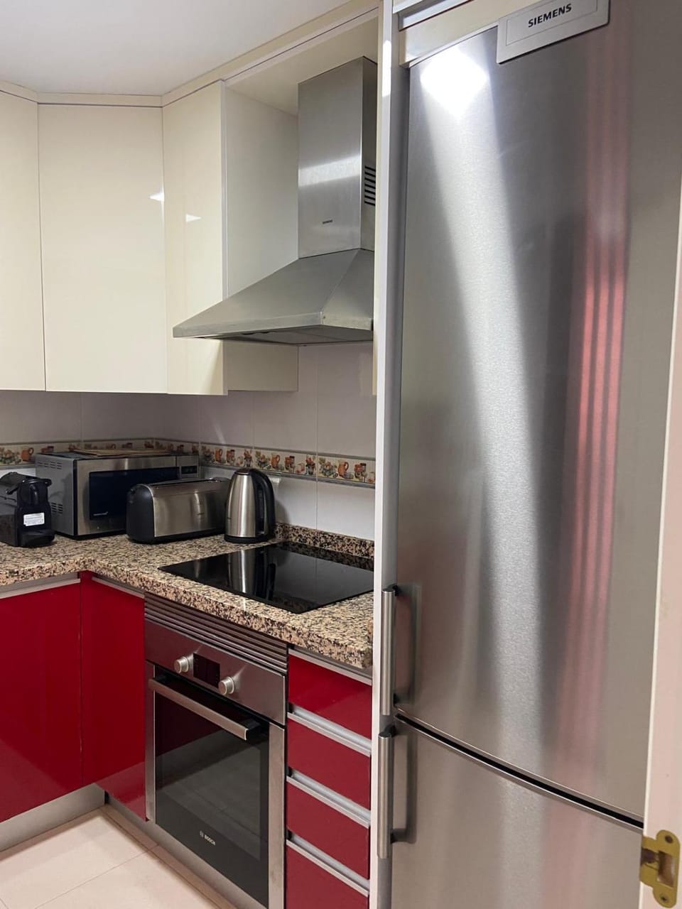 Kitchen or kitchenette, dishwasher, oven, stove