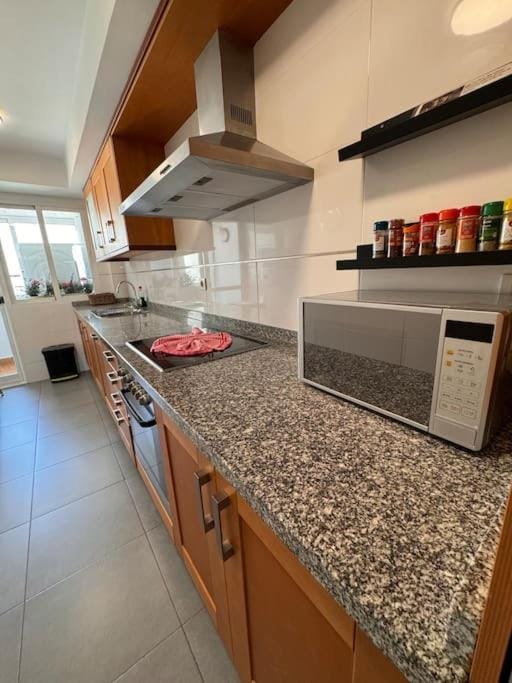 Kitchen or kitchenette, dishwasher, stove