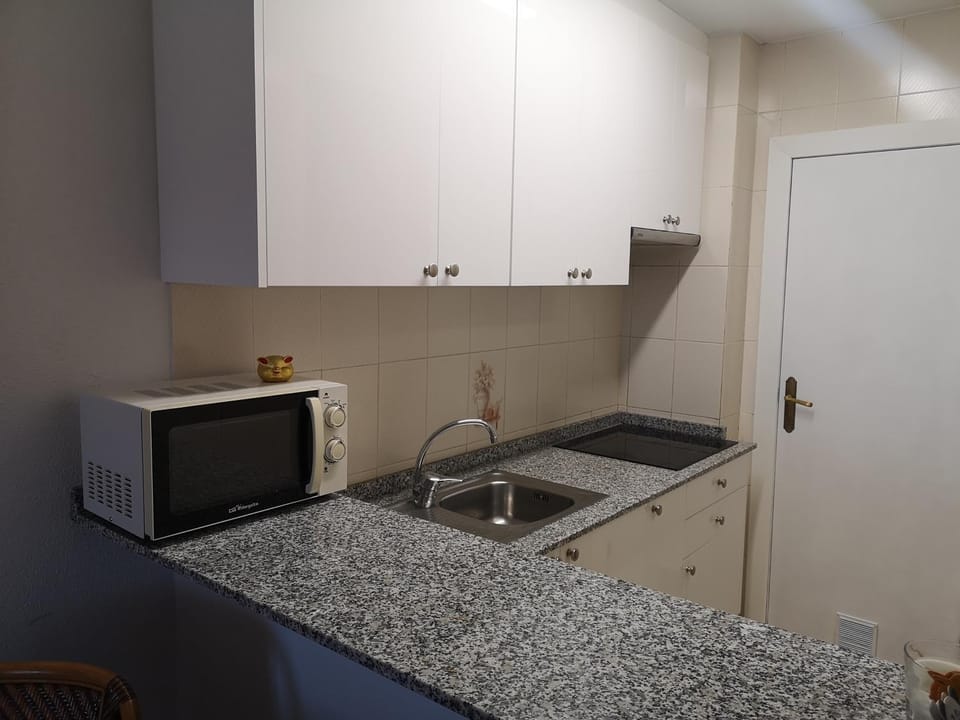 Kitchen or kitchenette, stove, kitchen