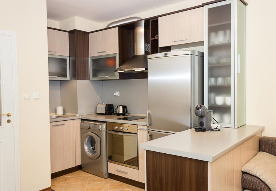 Kitchen or kitchenette, oven, stove, toaster, washing machine