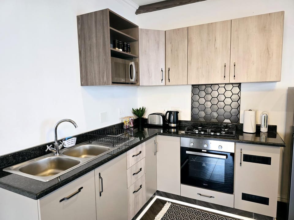 Kitchen or kitchenette, stove, toaster