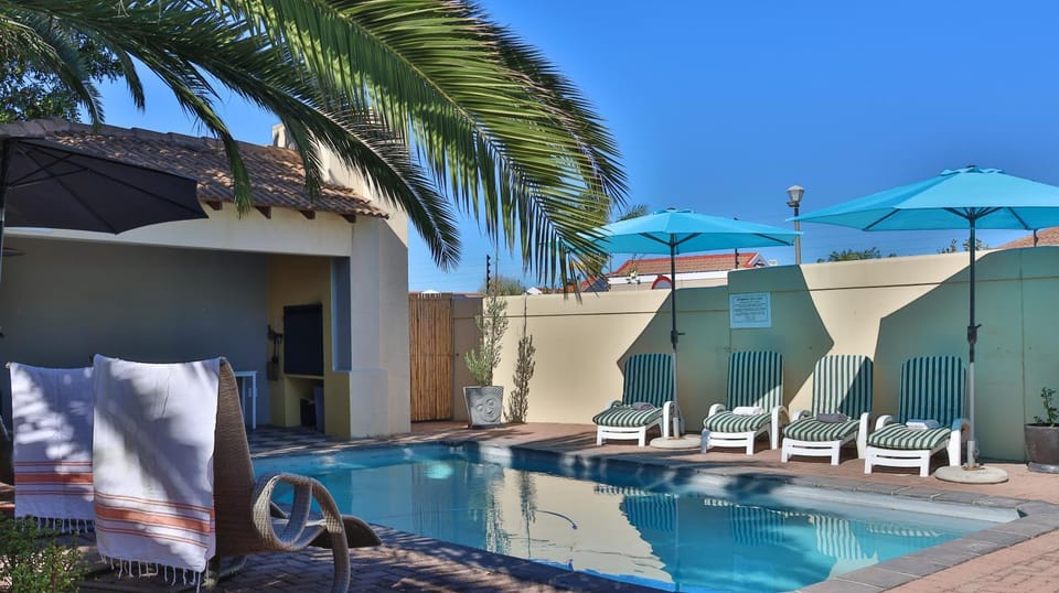 Patio, BBQ facilities, Swimming pool, sunbed
