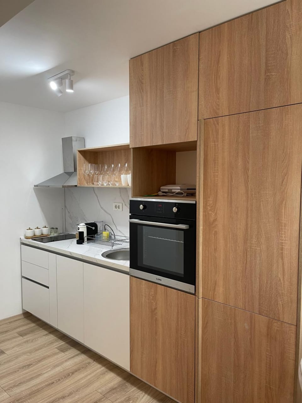 Kitchen or kitchenette, dishwasher, oven, stove
