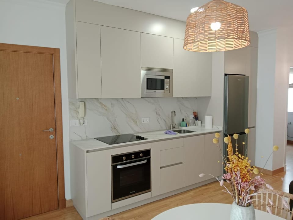 Kitchen or kitchenette, dishwasher, microwave, oven, stove