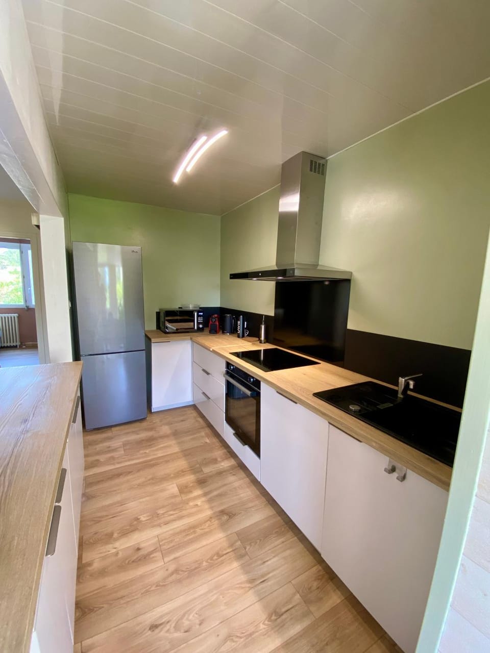 Kitchen or kitchenette, dishwasher, oven, stove