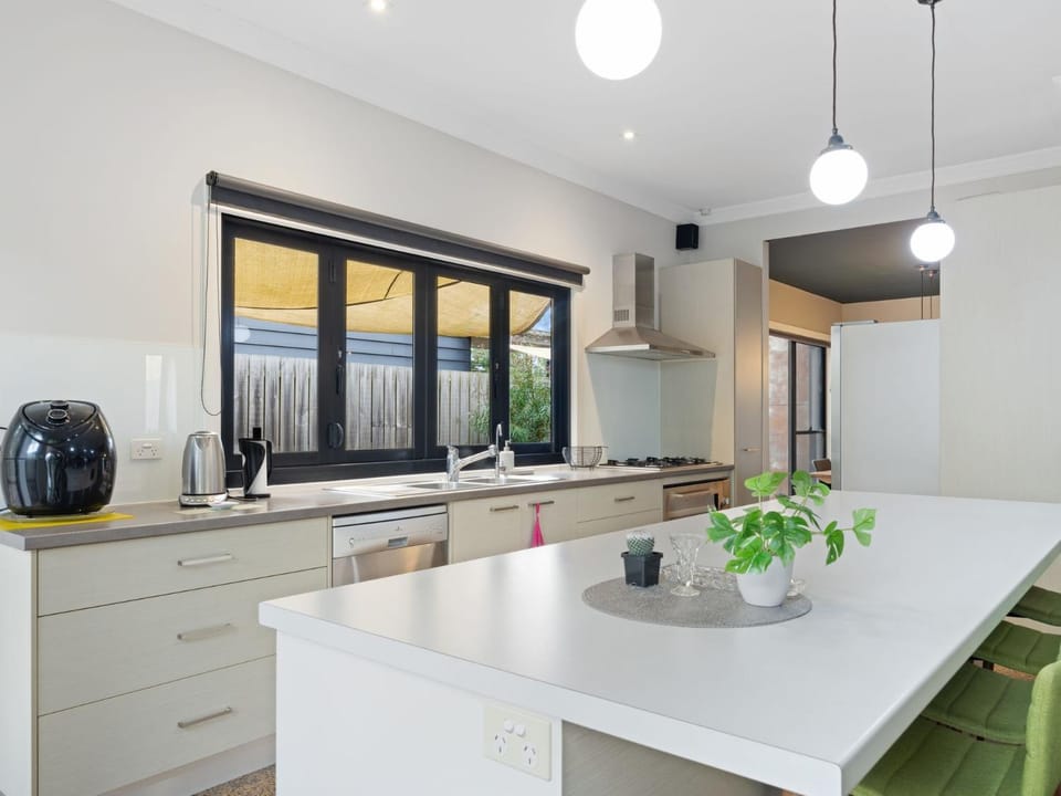 Kitchen or kitchenette, dishwasher, oven, stove