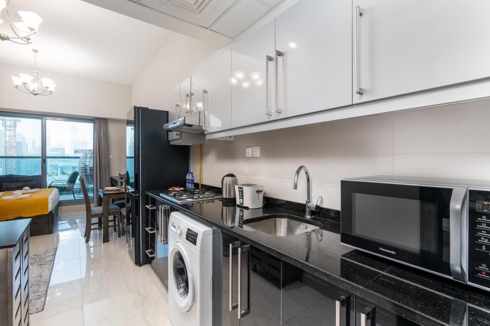 Kitchen or kitchenette, Dining area, oven, stove, toaster, washing machine, dryer