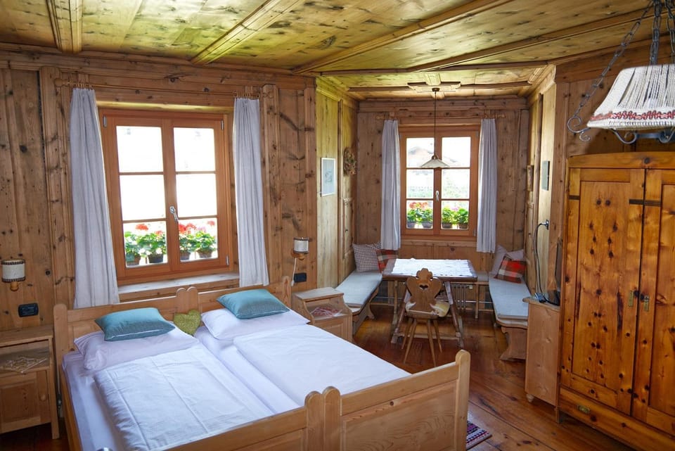 Bed, Living room, Seating area, Bedroom