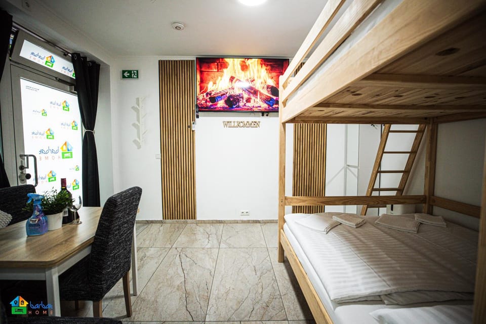 Communal lounge/ TV room, Bed, TV and multimedia, Living room, Photo of the whole room, Seating area, Evening entertainment, Bedroom, bunk bed, air conditioner
