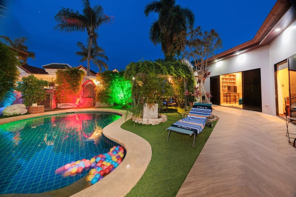 Property building, Patio, Night, Natural landscape, Garden, Solarium, Garden view, Pool view, Swimming pool, sunbed