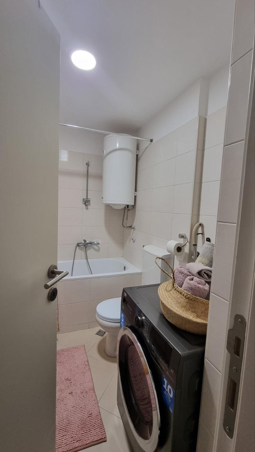 Toilet, Bathroom, towels, washing machine, dryer