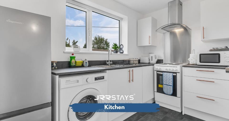 Kitchen or kitchenette, dishwasher, oven, stove, toaster