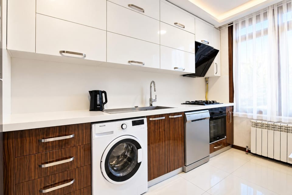 Kitchen or kitchenette, dishwasher, oven, stove, washing machine