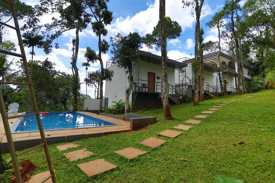 Property building, Day, Natural landscape, Pool view, Swimming pool