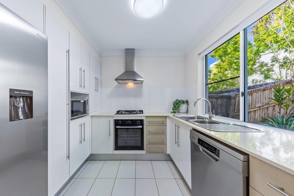 Kitchen or kitchenette, dishwasher, oven, stove