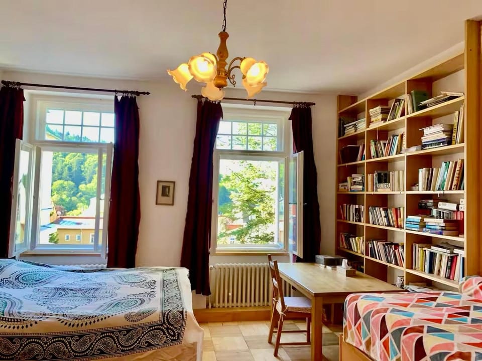 Bed, Library, Seating area, Bedroom