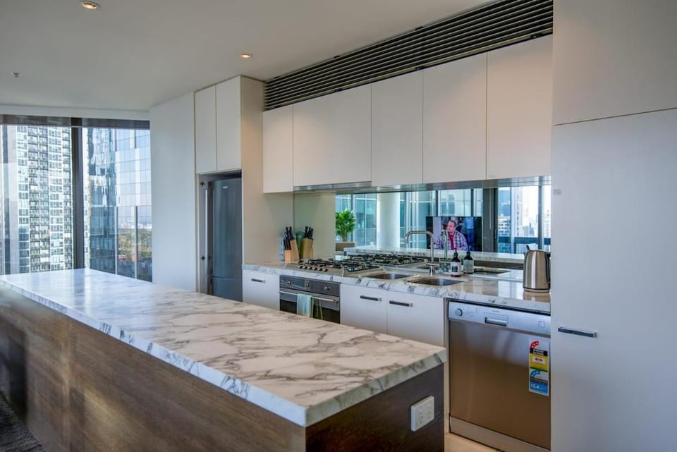 Kitchen or kitchenette, dishwasher, oven, stove
