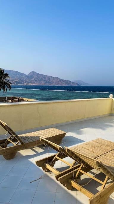 Property building, Natural landscape, Balcony/Terrace, Beach, Mountain view, Sea view, sunbed