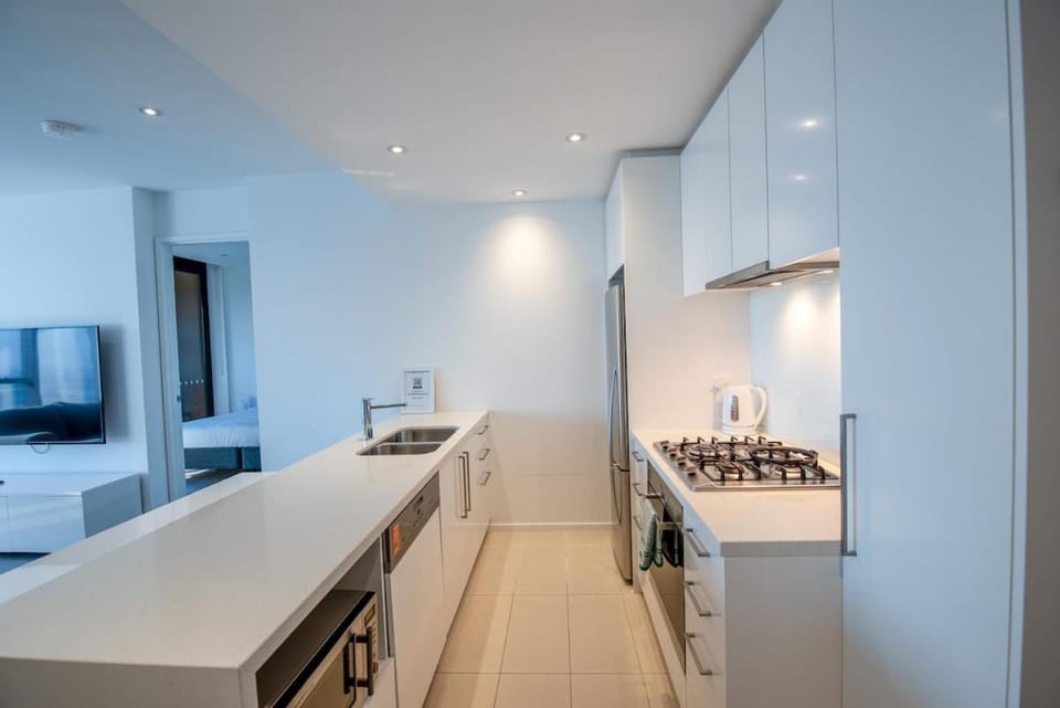 Kitchen or kitchenette, dishwasher, oven, stove