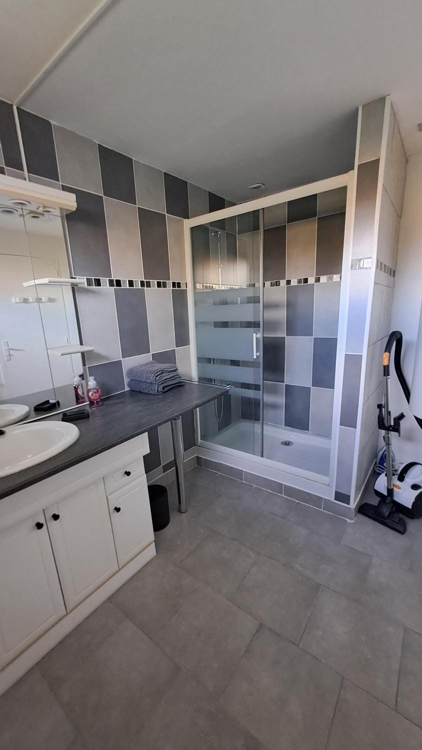 Bathroom, flat iron, hair dryier, towels, washing machine