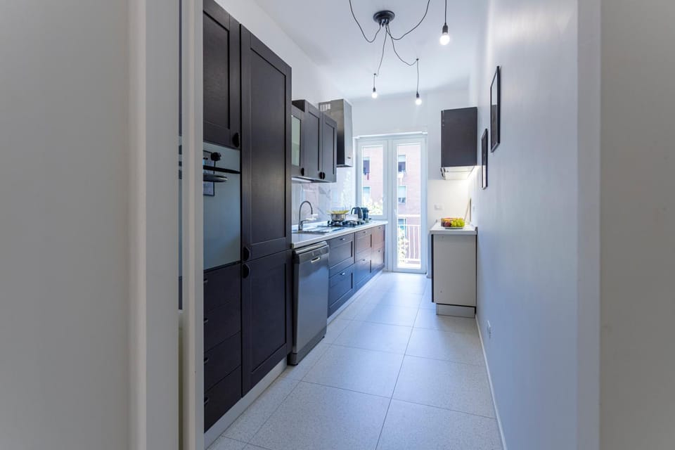 Kitchen or kitchenette, dishwasher, oven, stove