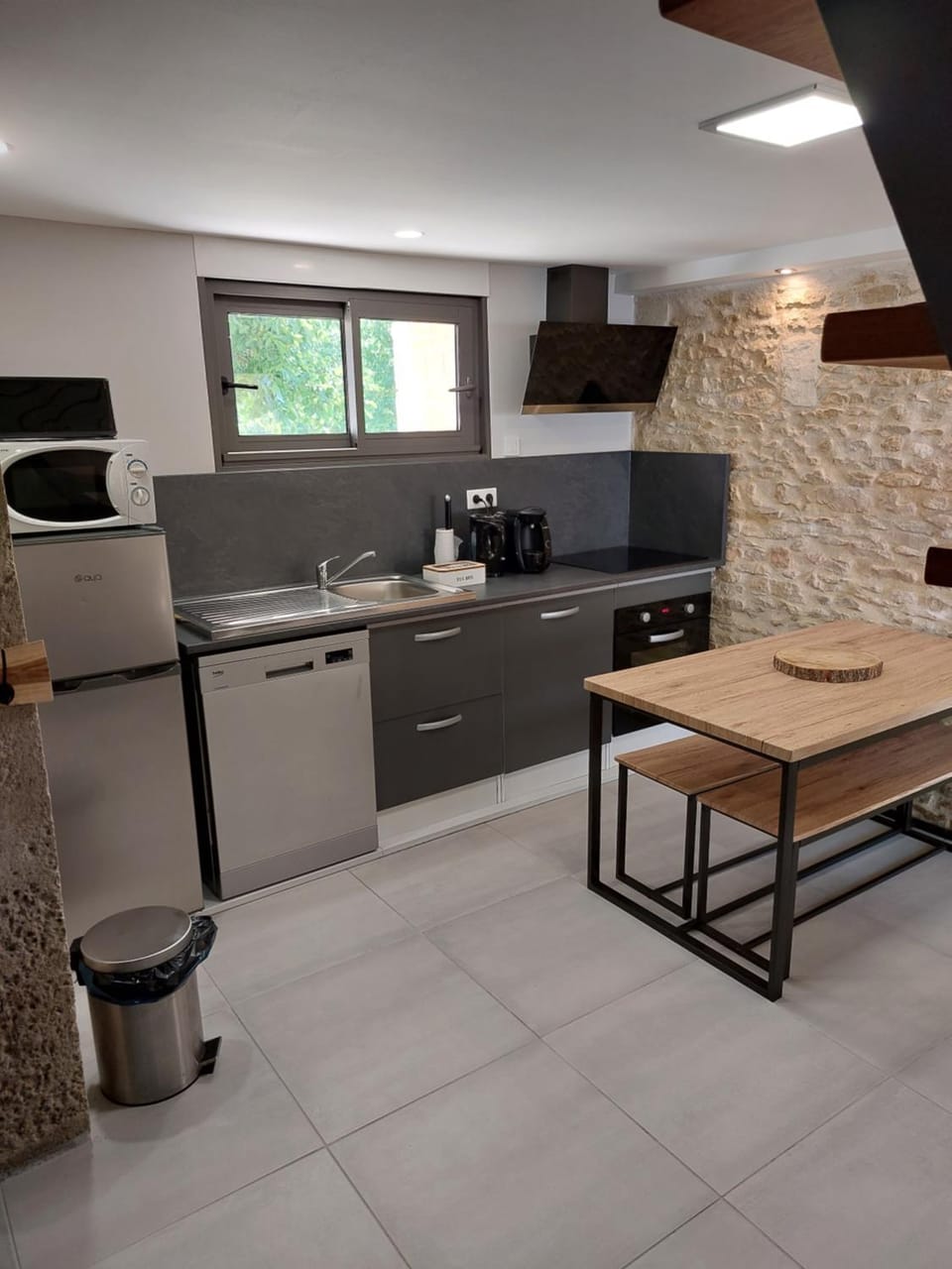 Kitchen or kitchenette, dishwasher, microwave, oven, stove, toaster