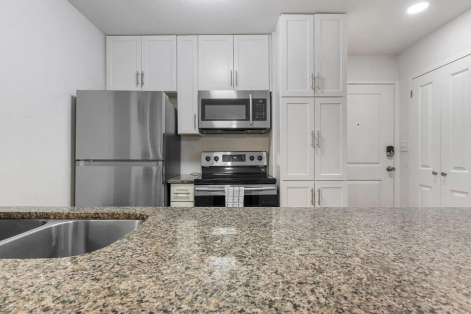 Kitchen or kitchenette, dishwasher, oven, stove, toaster