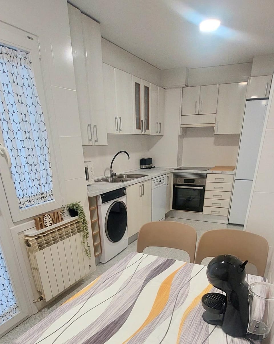 Kitchen or kitchenette, dishwasher, oven, stove, toaster, washing machine