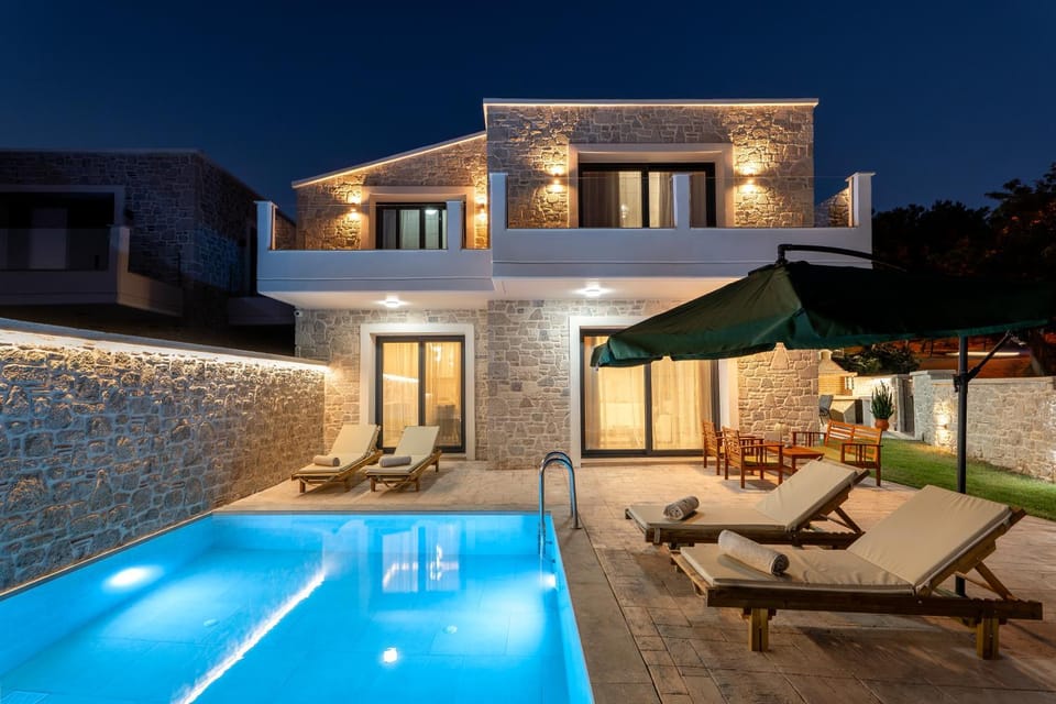 Property building, Patio, Night, Pool view, Swimming pool, sunbed