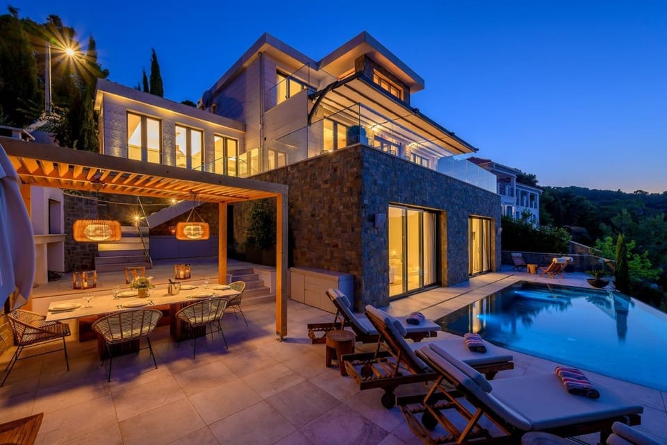 Property building, Patio, Night, Natural landscape, Pool view, Swimming pool