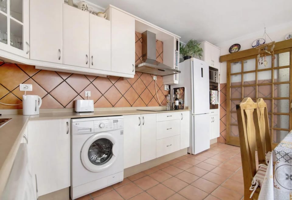 Kitchen or kitchenette, dishwasher, oven, stove, washing machine