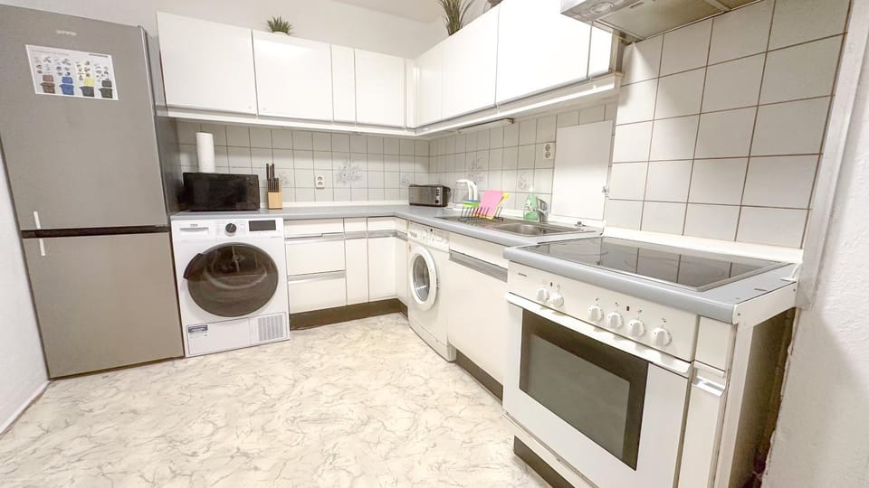 Kitchen or kitchenette, oven, stove, washing machine, dryer