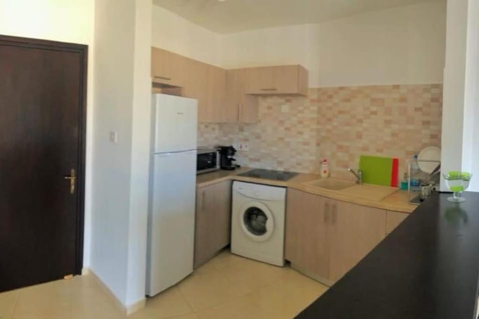 Kitchen or kitchenette, stove, washing machine