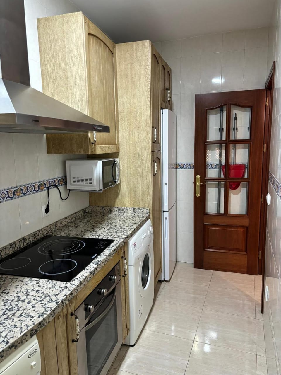 Kitchen or kitchenette, dishwasher, oven, stove