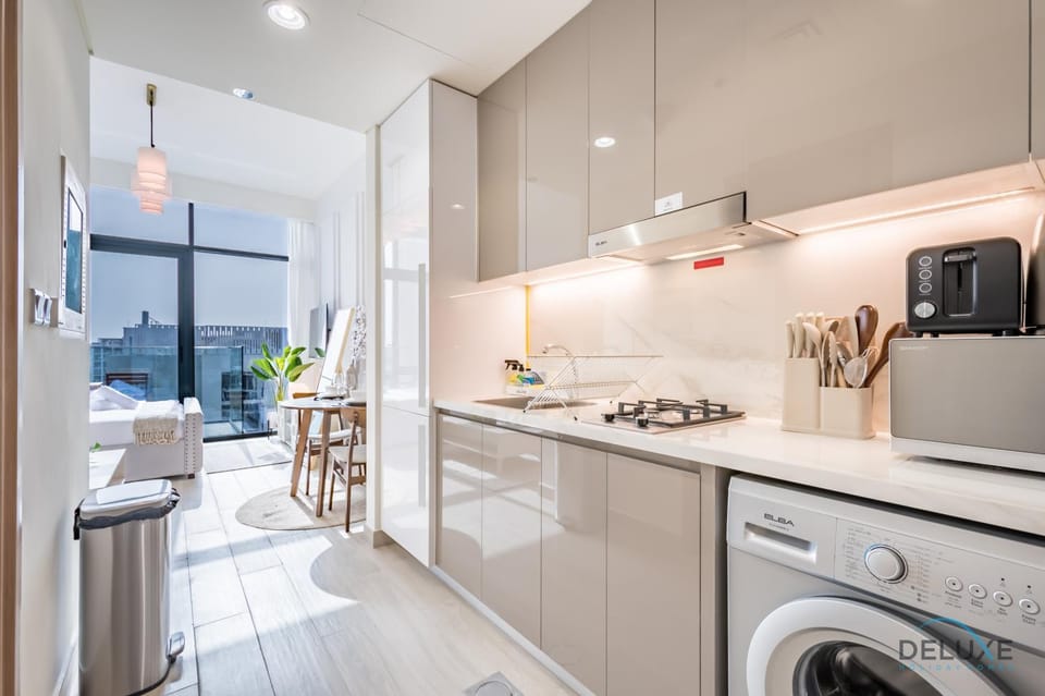 Kitchen or kitchenette, stove, toaster, washing machine
