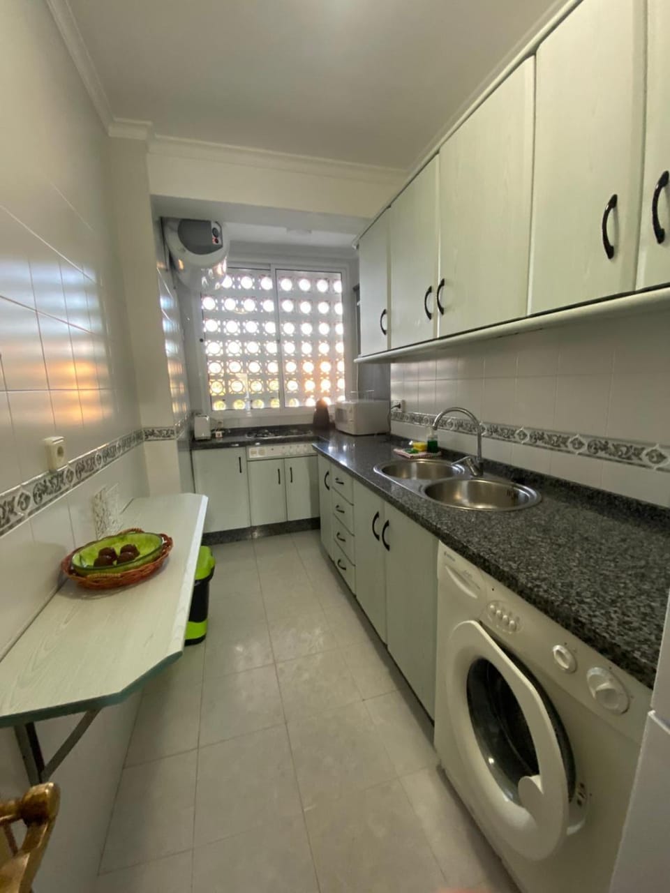 Kitchen or kitchenette, washing machine